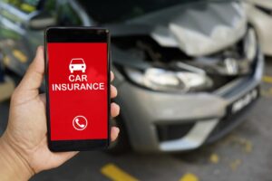 person calling their car insurance after an accident